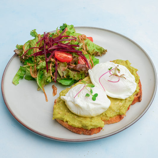 avocado toast with two poached eggs